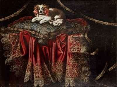 A spaniel seated on an embroidered cushion by Baroque