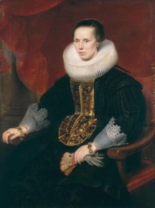 Girl wearing a black dress with feather head dress