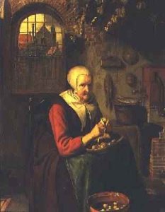 Lady seated in front of a fireplace with ham and bread on a table